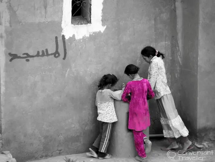 Children washing outside the Kasbah, Telouet, Morocco