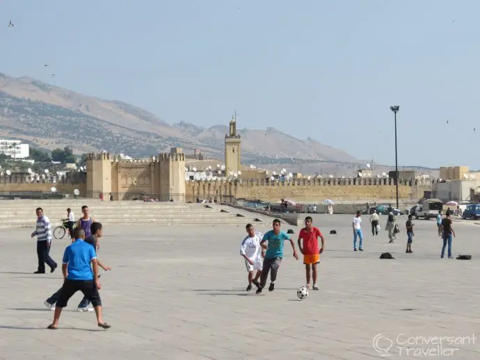 A universal language - local lads enjoying a game in Fes