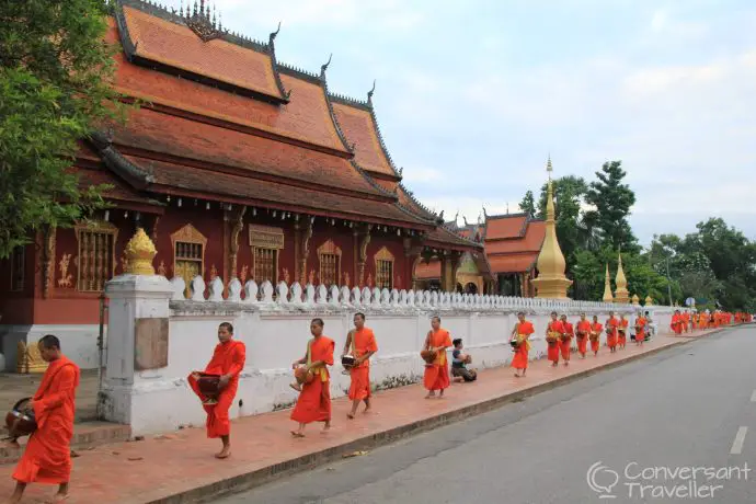 Things to do in Luang Prabang - monks receiving morning alms or Tak Bat