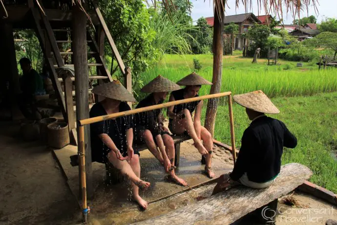 Washing off the mud, with an ingenious bamboo watering system