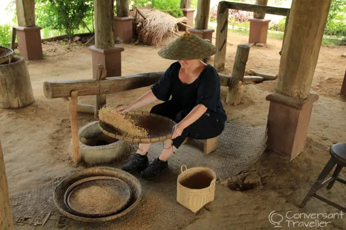 It's going to be a long wait for a Lao husband...winnowing at Living Land Rice Farm, Luang Prabang