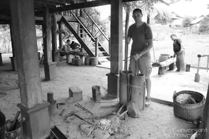 Hubbie operating a different sort of bellows...making fire for the blacksmiths at Living Land Rice Farm