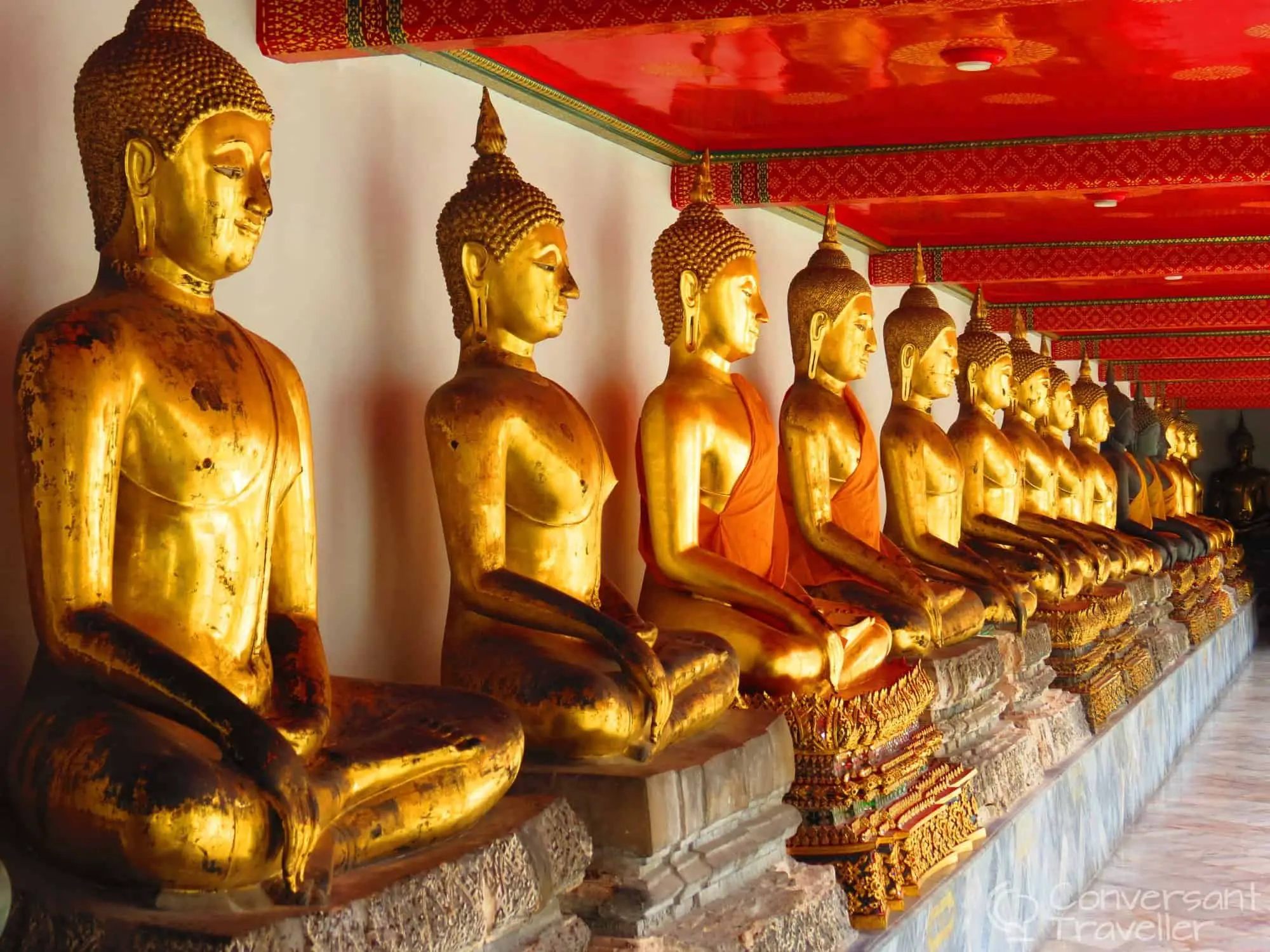 The famous line of regal buddhas at Wat Pho, Bangkok