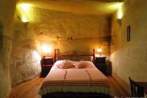 Bed in a cave with lights