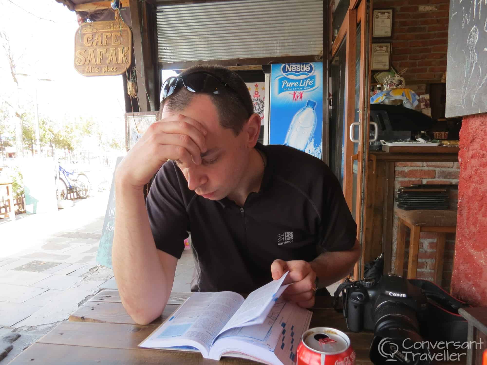 Hubbie checking what the Lonely Planet think of Café Safak, Goreme