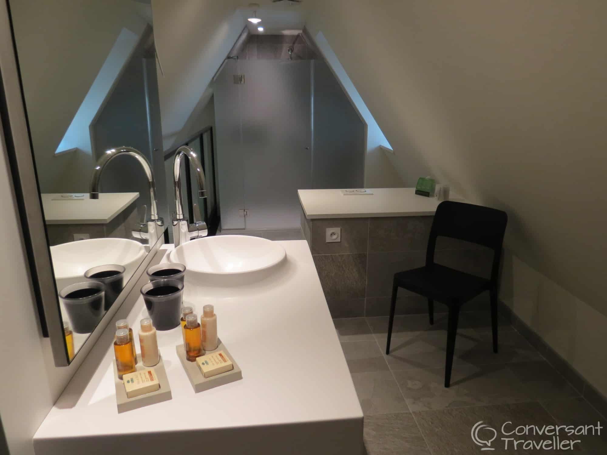 One of the elegantly designed bathrooms at Le Colombier making the most of the quirky roof space