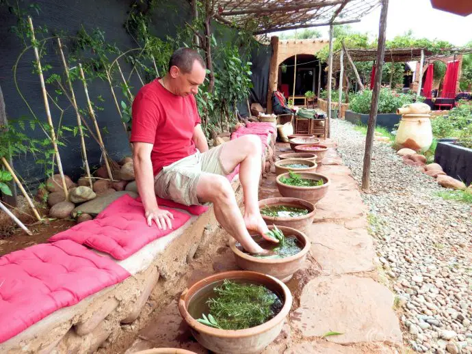 Hubbie using the foot spa at Donkeys at Paradis du Safran, Route d'Ourika, Morocco
