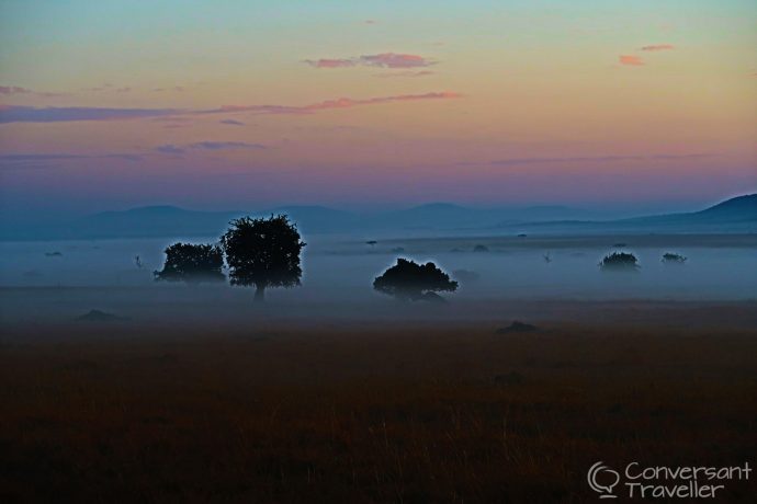 Saruni Mara luxury lodge - mist lingers on the Masai Mara North Conservancy plains in the mornings, Kenya