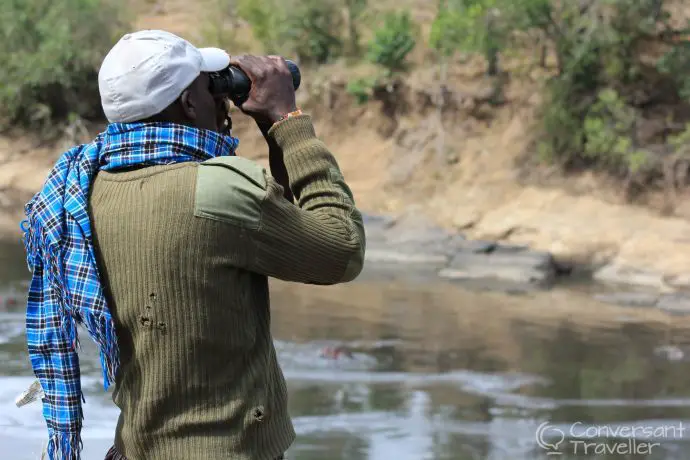 Hunting for hippos in Mara North Conservancy with our Masai Guide Lemeria, Kenya