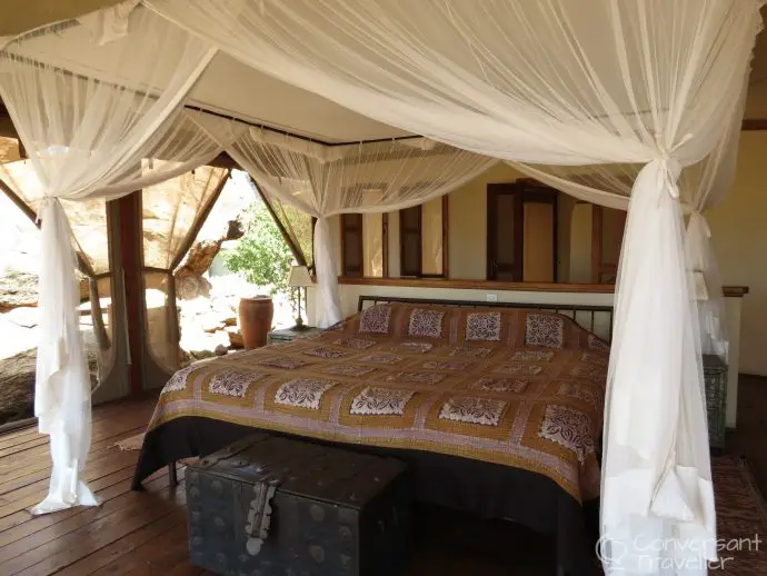 Four poster bed in villa 5 honeymoon suite at Saruni Samburu luxury lodge kenya