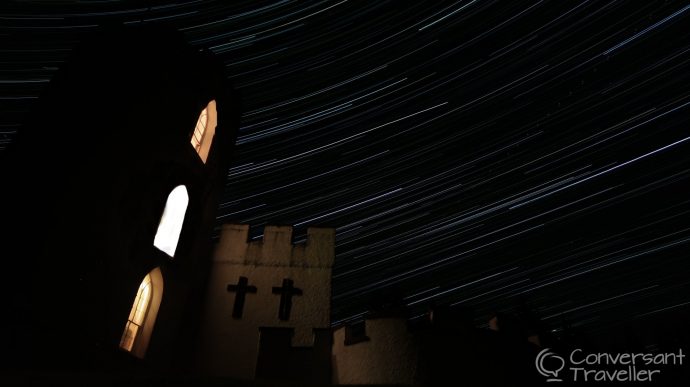 Star trails over the White Tower of Taymouth Castle, Scotland, a luxury wilderness retreat in the Highlands