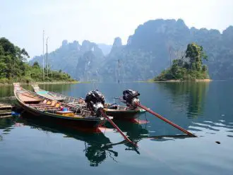 Long tail boats on Cheow Lan Lake, Koh Sok National Park, Thailand
