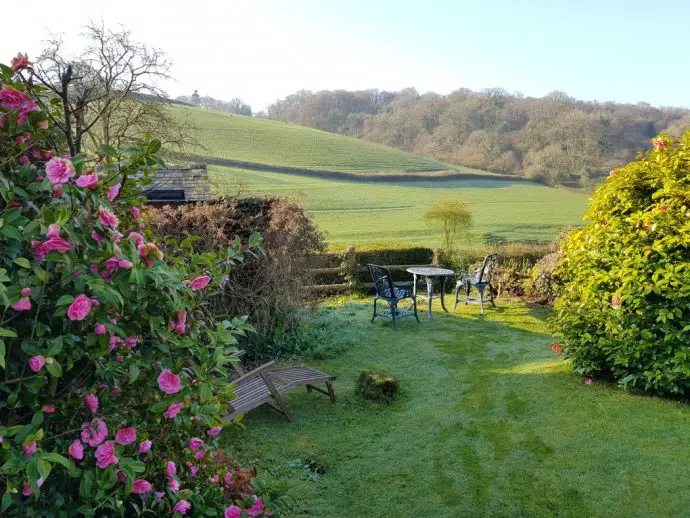 The sun rises over the valley at Pitt Farm Cottage in Exmoor