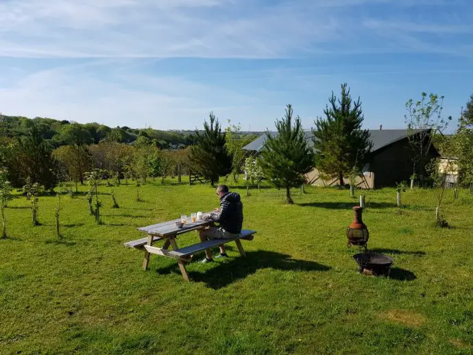 Eating breakfast at a picnic bench overlooking the countryside around Winklers Wood