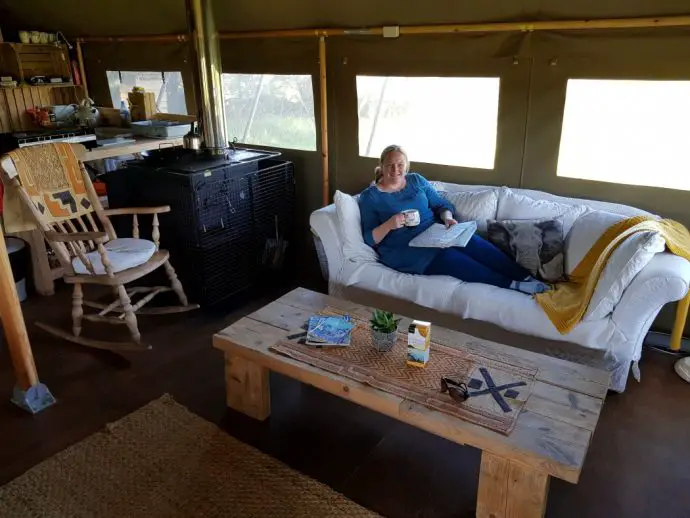 Sofa and living area in glamping tent