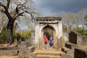 Standing in an archway at Gede Ruins National Monument near Watamu in Kenya