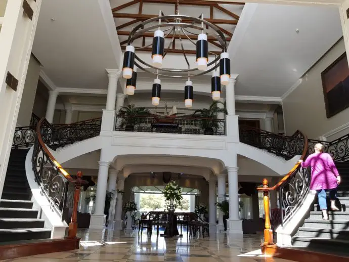 The grand staircase in the lobby of Hemingways Nairobi luxury hotel