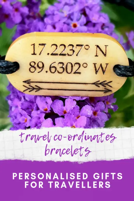 Travel co-ordinates bracelet on a purple flower