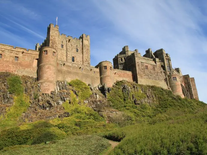 Large castle on top of rocky mound