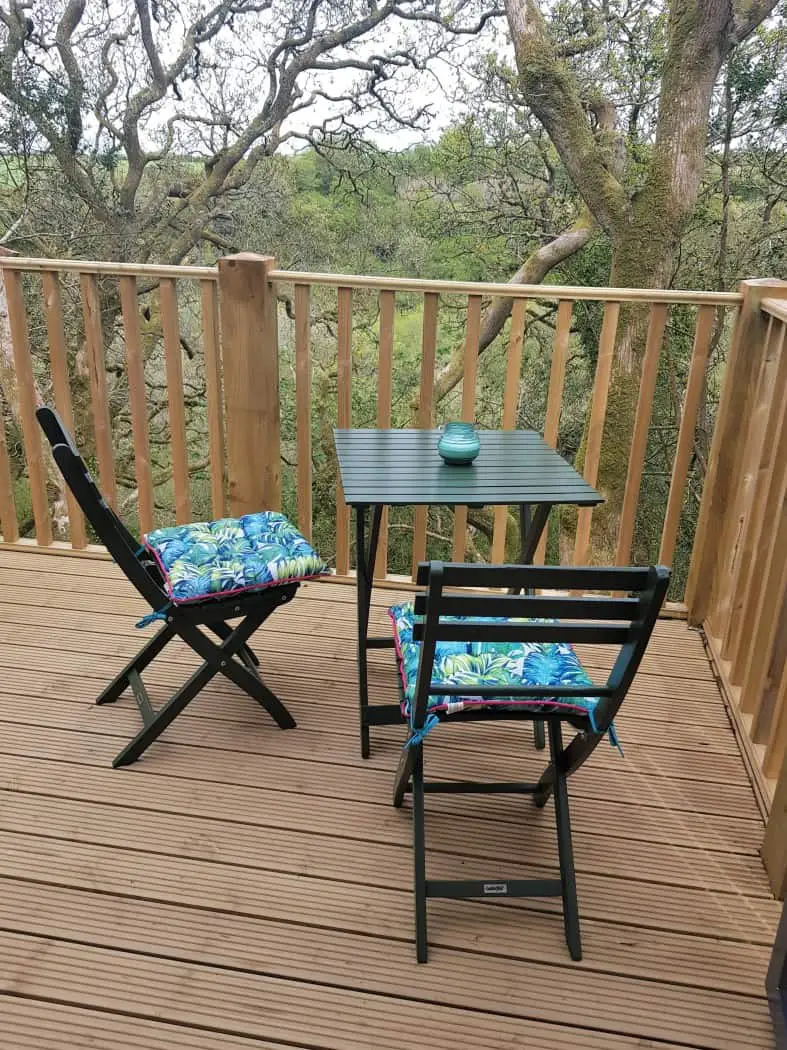 Deck seating of Chui Treehouse at Wrinklers Wood Glamping - hot tub holidays in Cornwall