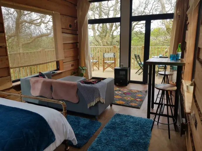 View looking out of Chui Treehouse at Wrinklers Wood Glamping - hot tub holidays in Cornwall