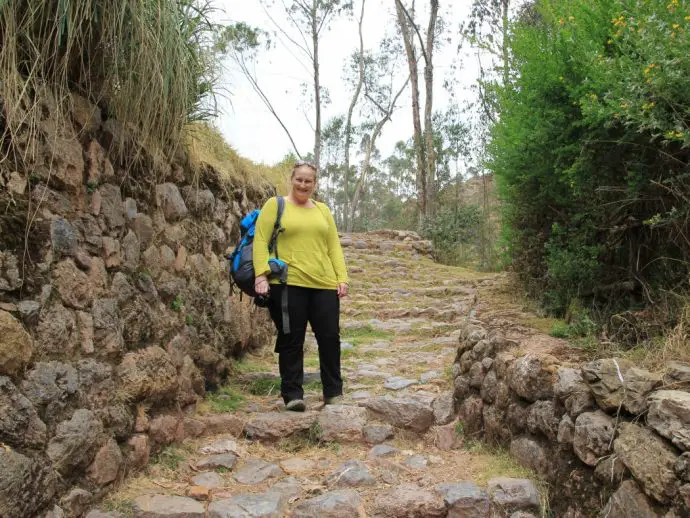 Walking on an Inca trail on the Chinchero to Urquillos hike