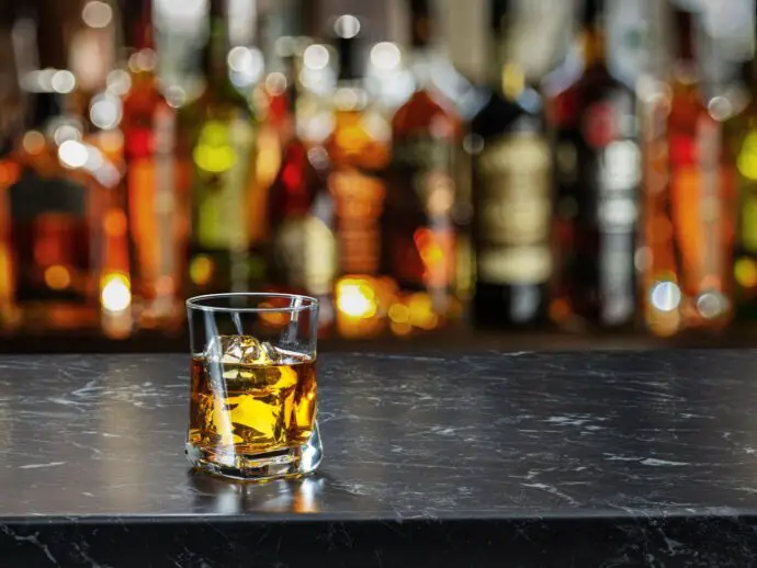 Whisky glass on a bar