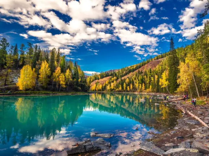 Emerald lake surrounded by mountains
