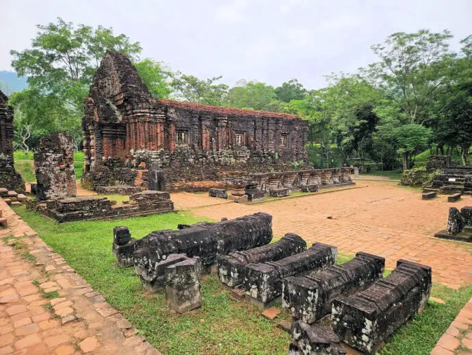 Red brick temple ruins surrounded by trees