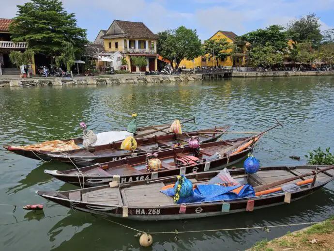 Traditional wooden boats moored on a riverbank