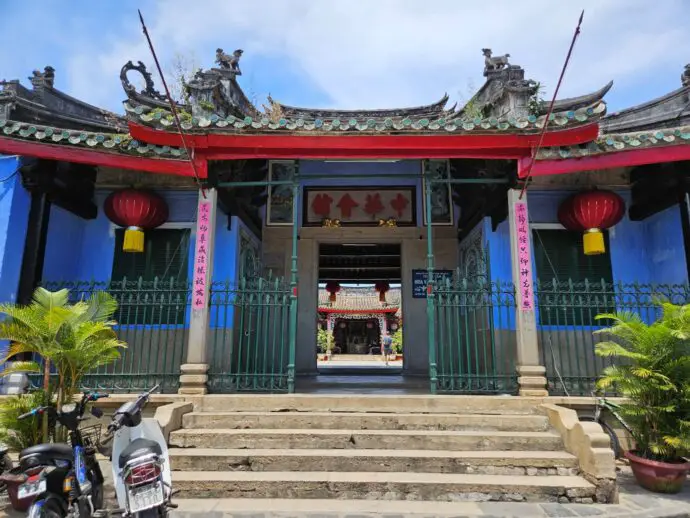 Blue and red temple with a curved roof