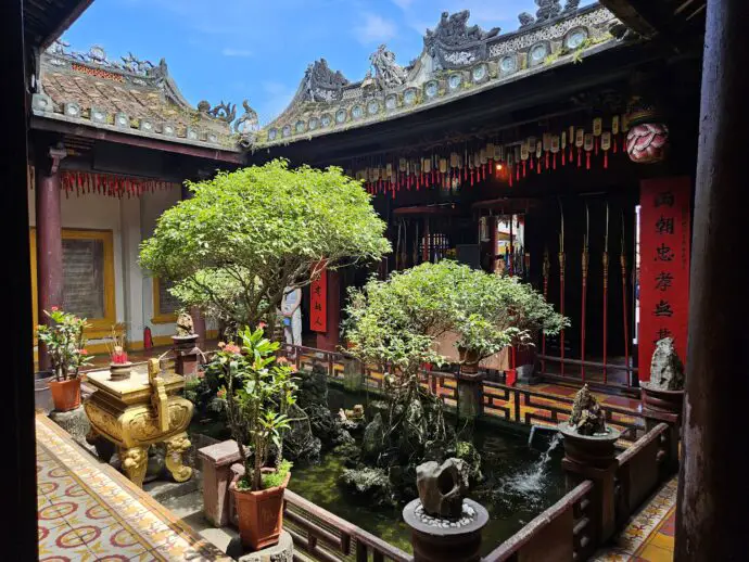Bonsai trees inside a temple courtyard