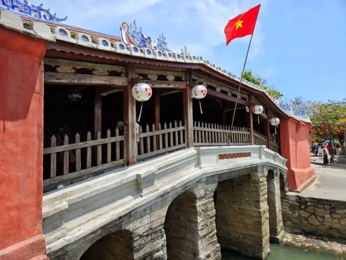 Wooden bridge with red flag on top