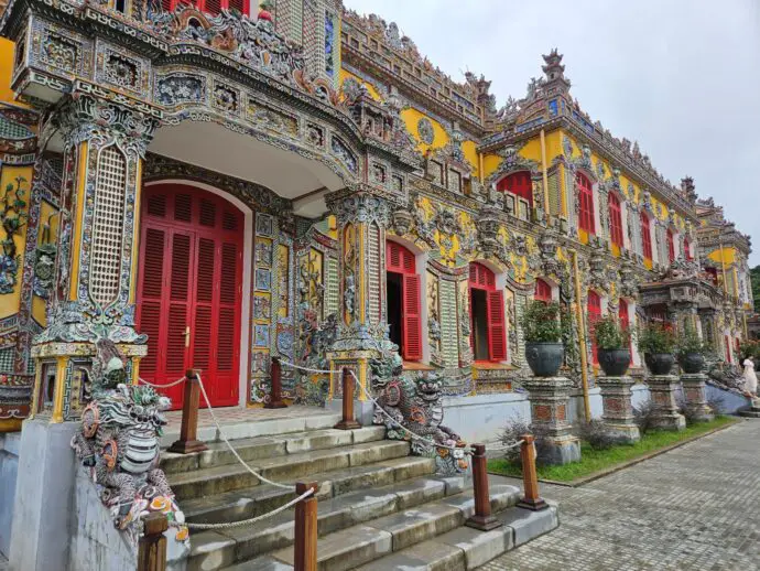 Ornate palace with 2 dragon statues outside