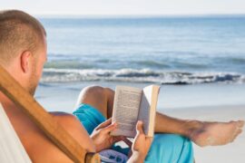 Man reading on beach